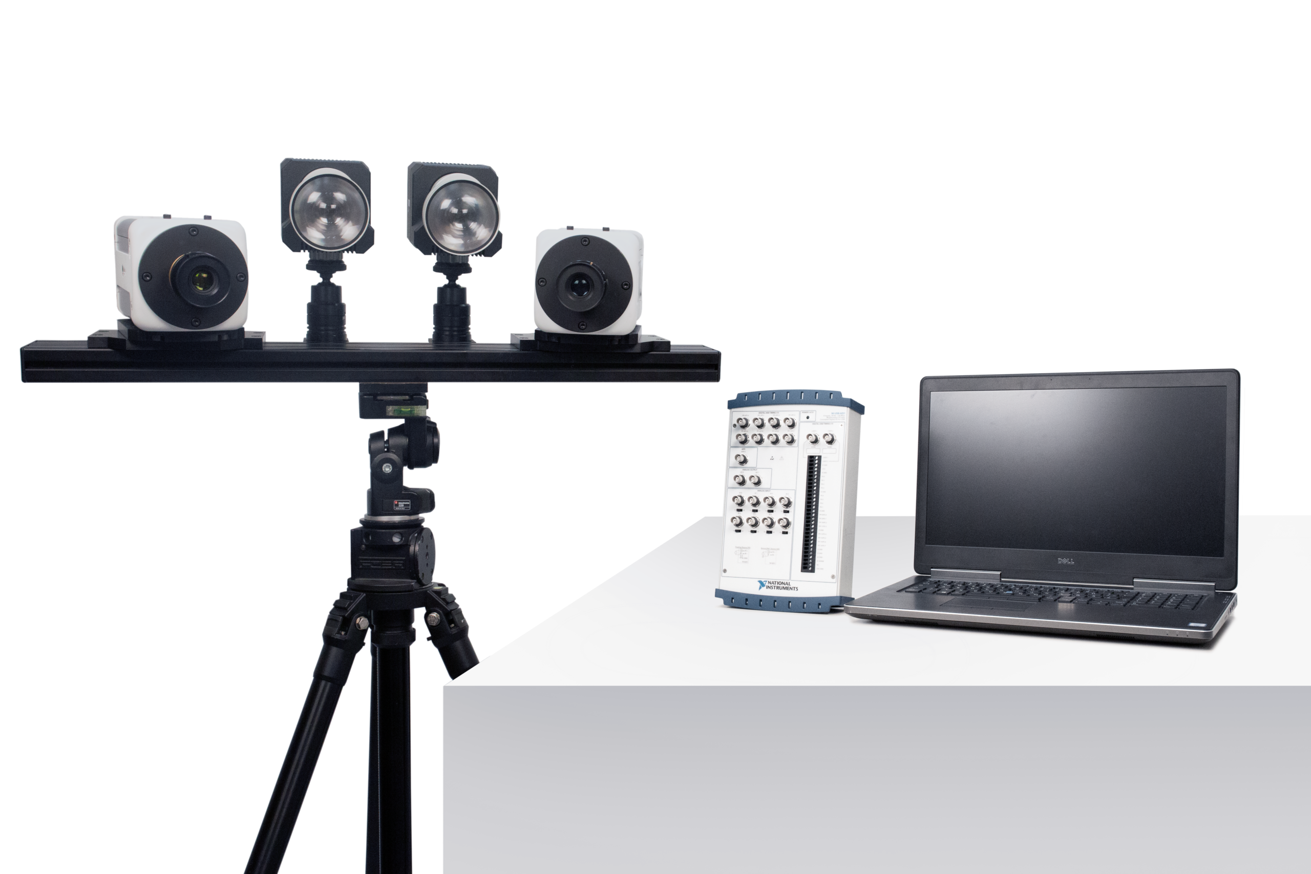 ARAMIS High Speed stereo cameras and illumination on a tripod beside a DAQ unit and laptop