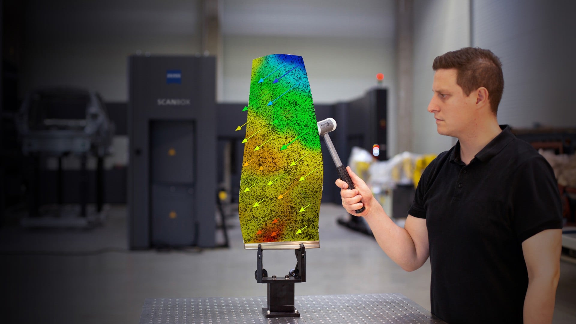 Fan blade vibration test with an impact hammer and colour-coded optical movement visualisation